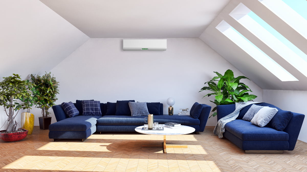 Wall mounted air conditioning unit in loft conversion room