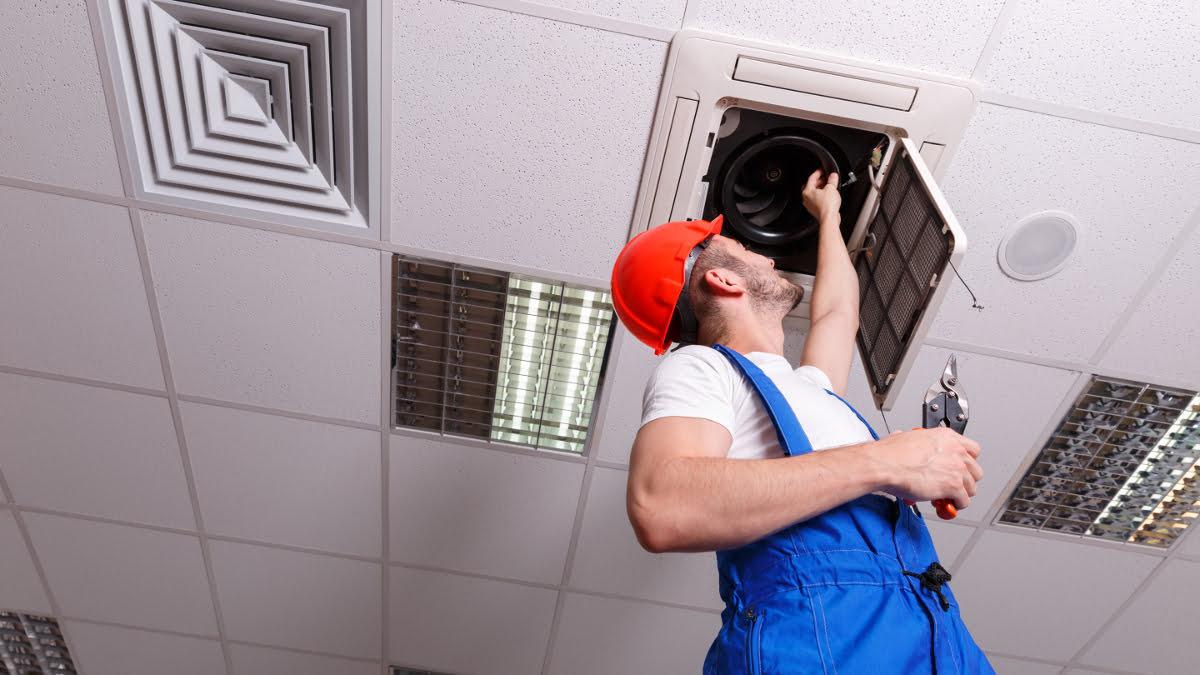 Air conditioning engineer services a ceiling cassette unit