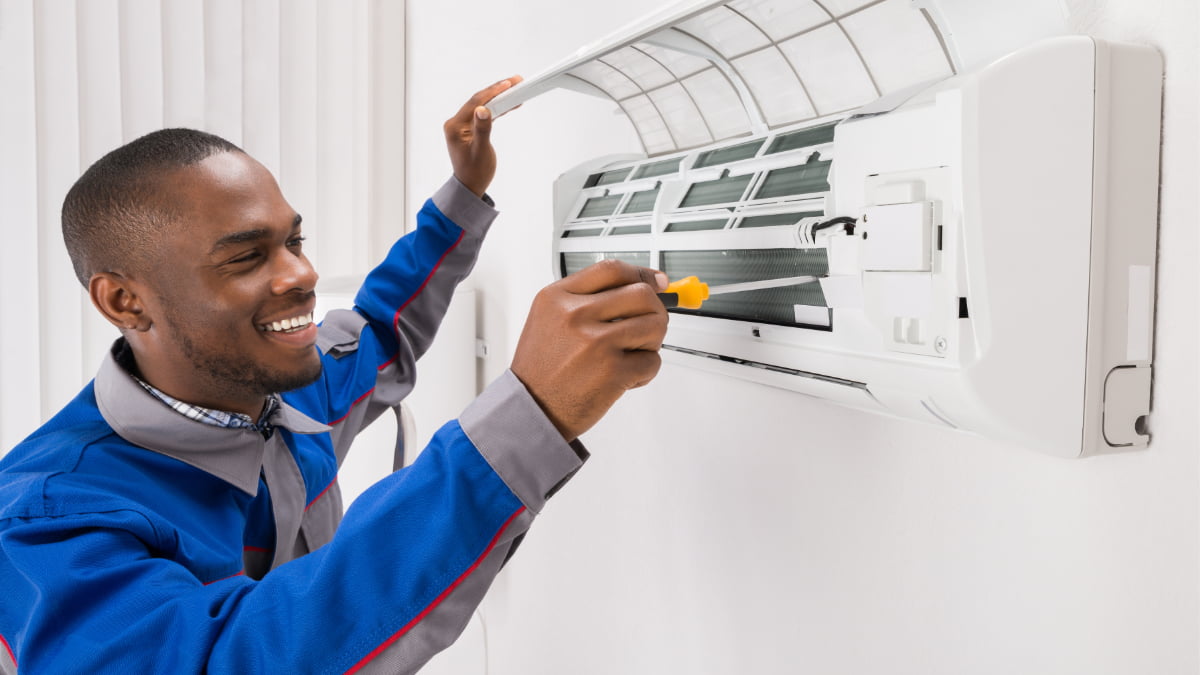 man installing air conditioning