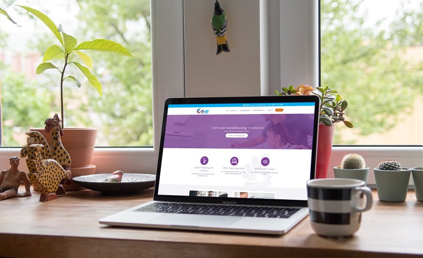 Laptop in kitchen showing D-Air website